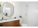 Modern bathroom featuring a sleek vanity, stylish mirror, and walk-in shower at 1205 W 101St Ave, Northglenn, CO 80260