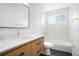 Updated bathroom featuring a modern vanity, stylish mirror, and a shower/tub combo at 1205 W 101St Ave, Northglenn, CO 80260