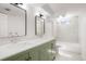 Updated bathroom featuring a double vanity, modern fixtures, and a separate tub/shower at 1205 W 101St Ave, Northglenn, CO 80260