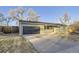Charming single-story home with an attached garage and a large driveway at 1205 W 101St Ave, Northglenn, CO 80260