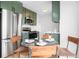 Kitchen and dining area featuring stainless appliances, an eat-in table, and modern décor at 1205 W 101St Ave, Northglenn, CO 80260