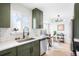 Stylish kitchen with stainless steel appliances, plenty of counter space and a dining area at 1205 W 101St Ave, Northglenn, CO 80260