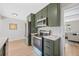 Well-lit kitchen featuring stainless steel appliances, subway tile backsplash, and modern cabinetry at 1205 W 101St Ave, Northglenn, CO 80260