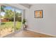 Cozy living area with sliding glass doors leading to a backyard and ample natural light at 1205 W 101St Ave, Northglenn, CO 80260
