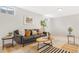 Modern basement living room featuring ample natural light, contemporary decor, and stylish furniture at 1205 W 101St Ave, Northglenn, CO 80260
