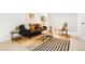Bright living room with stylish decor, colorful rug, and modern furnishings at 1205 W 101St Ave, Northglenn, CO 80260