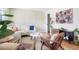 Bright and open living room featuring modern decor, hardwood floors, and stylish furniture at 1205 W 101St Ave, Northglenn, CO 80260