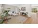Bright living room featuring wood floors, modern decor, and plenty of natural light at 1205 W 101St Ave, Northglenn, CO 80260