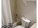 Bathroom including tub, shower, toilet, and white walls at 1255 S Wheeling Way, Aurora, CO 80012