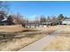 Outdoor community pool, surrounded by a fence and grassy space at 1255 S Wheeling Way, Aurora, CO 80012