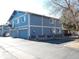 Rear exterior of townhouse with garage, parking, and outdoor utilities at 1255 S Wheeling Way, Aurora, CO 80012