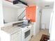 Well-lit kitchen featuring modern appliances and ample counter space, perfect for cooking at 1255 S Wheeling Way, Aurora, CO 80012