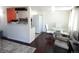 Open-concept living area seamlessly connects to the kitchen, perfect for modern living at 1255 S Wheeling Way, Aurora, CO 80012