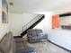 Comfortable living area with a staircase, providing an inviting space for relaxation at 1255 S Wheeling Way, Aurora, CO 80012