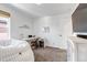 Bright bedroom featuring a white desk, comfortable chair, and a cozy beanbag, perfect for work or relaxation at 8049 Monte Vista Cir, Littleton, CO 80125