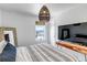 Comfortable bedroom with a patterned bedspread, ample light, and tasteful decor at 8049 Monte Vista Cir, Littleton, CO 80125