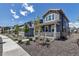 Charming home featuring professionally landscaped yard and inviting front porch seating at 8049 Monte Vista Cir, Littleton, CO 80125