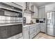 Modern kitchen featuring stainless steel appliances, gray cabinetry, and gas range at 8049 Monte Vista Cir, Littleton, CO 80125