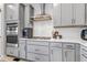 Modern kitchen featuring stainless steel appliances and gas cooktop at 8049 Monte Vista Cir, Littleton, CO 80125