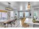 Bright and airy living room and dining area with modern decor and ample natural light at 8049 Monte Vista Cir, Littleton, CO 80125