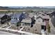 Scenic view of a charming neighborhood featuring manicured lawns and diverse architectural styles, backed by a stunning mountain range at 8049 Monte Vista Cir, Littleton, CO 80125