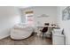 Bright office space with a white desk, comfortable chair, and a cozy beanbag at 8049 Monte Vista Cir, Littleton, CO 80125