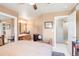 Cozy bedroom with a view into the bathroom and upstairs hallway, showcasing its layout at 2174 Meadow Vale Rd, Longmont, CO 80504