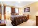 Comfortable bedroom with patterned bedding, soft lighting, and a serene ambiance at 2174 Meadow Vale Rd, Longmont, CO 80504