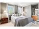 Serene bedroom featuring soft gray tones, ample natural light, and stylish furnishings at 2174 Meadow Vale Rd, Longmont, CO 80504