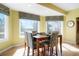 Bright dining room featuring three windows with decorative window coverings at 2174 Meadow Vale Rd, Longmont, CO 80504