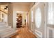 Entryway and staircase leading to formal dining room and upper floors at 2174 Meadow Vale Rd, Longmont, CO 80504