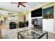 Comfortable living room featuring a fireplace, built-in shelves and modern furniture at 2174 Meadow Vale Rd, Longmont, CO 80504