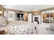 Luxurious main bedroom with fireplace, flat screen tv, and decorative touches at 2174 Meadow Vale Rd, Longmont, CO 80504