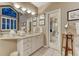 A well-appointed bathroom offers a granite vanity, soaking tub and separate glass shower at 3201 Country Club Pkwy, Castle Rock, CO 80108
