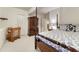 Bedroom featuring a four-poster bed, wooden desk, and neutral decor at 3201 Country Club Pkwy, Castle Rock, CO 80108