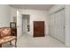 Open bedroom with ample closet space, a decorative wardrobe, and neutral carpet at 3201 Country Club Pkwy, Castle Rock, CO 80108