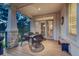 Relaxing covered patio with comfortable seating and scenic outdoor views at 3201 Country Club Pkwy, Castle Rock, CO 80108