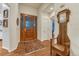 Welcoming foyer with hardwood floors, wooden door, and decorative accents at 3201 Country Club Pkwy, Castle Rock, CO 80108