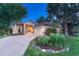 Charming home with stone accents, manicured landscaping, and inviting front porch and bench at 3201 Country Club Pkwy, Castle Rock, CO 80108