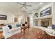 Bright living room features a fireplace and open layout at 3201 Country Club Pkwy, Castle Rock, CO 80108