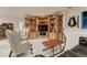 Inviting living room area featuring custom wood built-ins for a cozy and organized space at 3201 Country Club Pkwy, Castle Rock, CO 80108