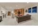 Spacious living room featuring custom wood built-ins and a comfortable leather couch at 3201 Country Club Pkwy, Castle Rock, CO 80108