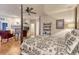 A stunning main bedroom boasts a four-poster bed, fireplace, and an abundance of natural light at 3201 Country Club Pkwy, Castle Rock, CO 80108