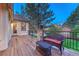 Enjoy this outdoor space featuring a wicker bench and table perfect for relaxing and enjoying the greenery at 3201 Country Club Pkwy, Castle Rock, CO 80108
