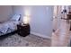 Bedroom featuring a bed, nightstand, and connecting kitchen area at 650 S Clinton St # 2A, Denver, CO 80247