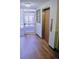 Hallway featuring an elevator entrance with wood-look flooring at 650 S Clinton St # 2A, Denver, CO 80247