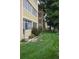 Exterior view of building featuring well-manicured landscaping and greenery at 650 S Clinton St # 2A, Denver, CO 80247