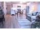 Cozy living room and kitchen combo, featuring stylish furniture and modern appliances at 650 S Clinton St # 2A, Denver, CO 80247