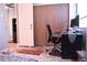 Home office area featuring a desk, chair, and closet at 650 S Clinton St # 2A, Denver, CO 80247