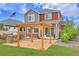A well-maintained backyard features a pergola, built-in grill, and spacious lawn for outdoor enjoyment at 21900 E 46Th Pl, Aurora, CO 80019